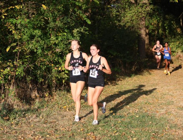 Junior Andra Veleta and senior Lizzie Moreno compete in the Johnson County Championship at Franklin Community, where both would finish in the top 20. Both the girls and boys team would take home the County title this year.