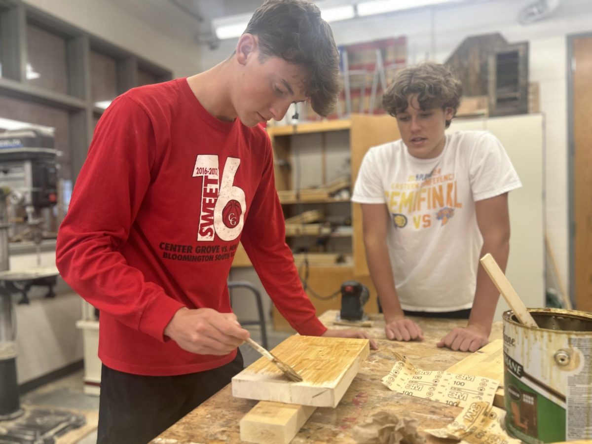 Sophomore Bryson Hill works on staining his wood cutting board that he made during his fourth period construction class. “I enjoy building things and learning about power tool's during this class.” Hill said. “We do a bunch of projects and in this one we built a cutting board which has been one of my favorite's.” 