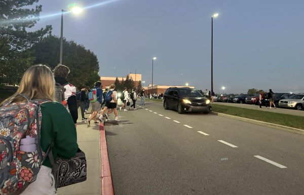 In the morning before school, students jaywalk across Trojan Lane instead of using the crosswalk by the Hall of Excellence.