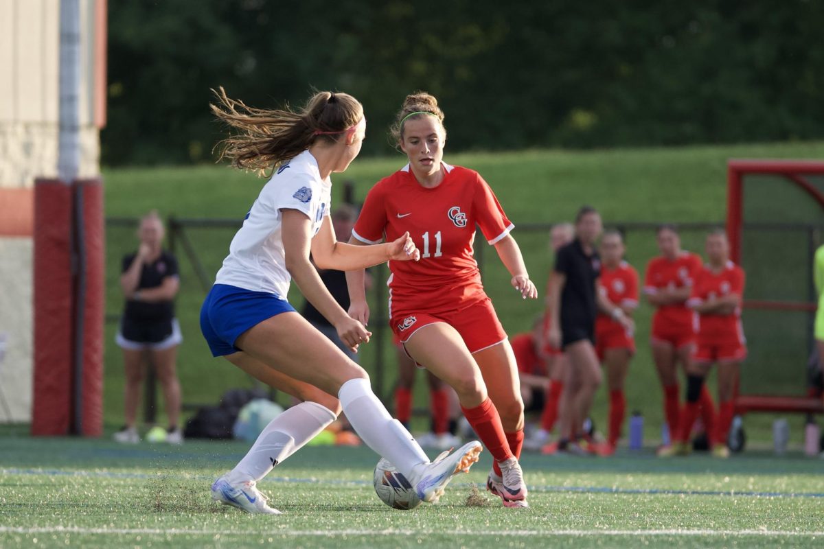 Maddie Guilfoy battles a Columbus North player for possession during CG's regular season 3-1 victory over the Bull Dogs.