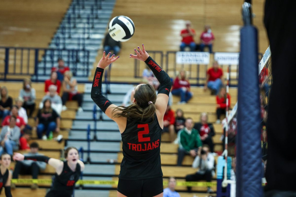 Sophomore Anabelle Schembra sets the ball during the Trojans' Sectional Championship victory against Southport.