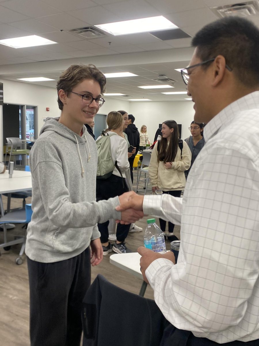 Sophomore Austin Petkovich meets with Eugene Pascual, lead engineer at Eaton, at the SNHS speaker panel. At the 2024 Science National Honors Society’s speaker panel, students can learn from professionals in various fields on what it is like to work in their field, ask questions and make connections with the guest speakers. “I came to the speaker panel to get professional opinions on stuff. These are the people who have been through high school, college and started their careers. They told me the ups, downs, and challenges of their career, and even if it is not as smooth as you want it to be, you get there in the end,” Petkovitch said.