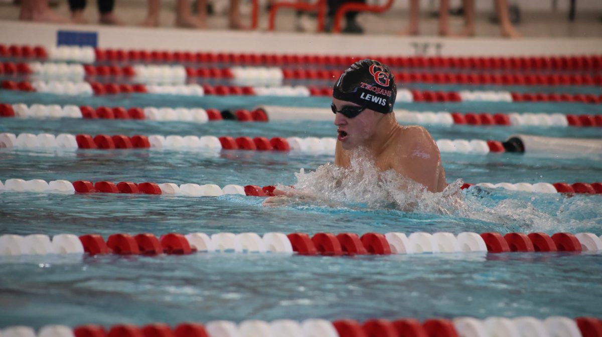 Senior Isaac Lewis competes in the 100 meter breaststroke during the Hall of Fame Classic meet on December 7, 2024.