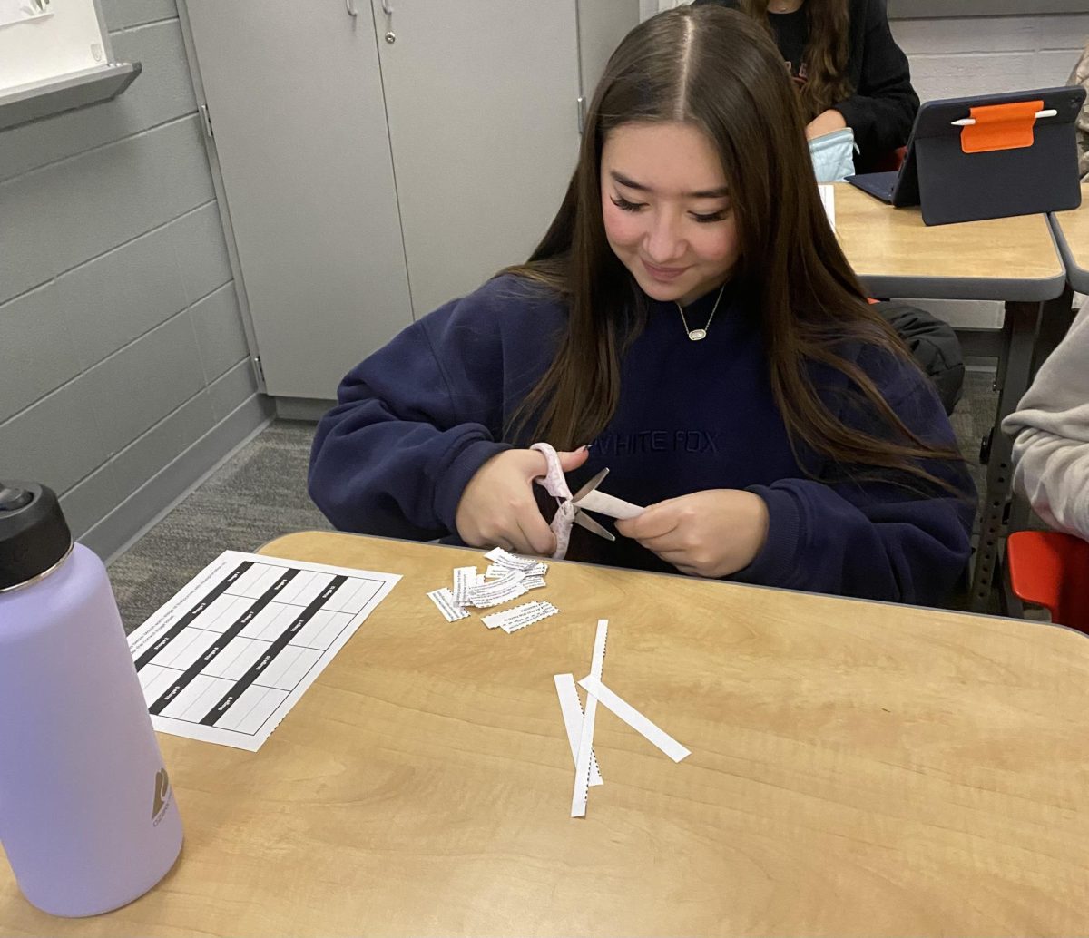 In Shiela Bickley's English 9 Honors class, freshman Kaydence Crouch uses paper cutouts to create the structure of a hero's journey. Students prepared for the activity by watching a movie about a hero's journey: Shrek. “I had fun watching Shrek and doing something different in class,” Crouch said. “Learning about this makes me able to follow movies and books more easily and have a better understanding of the timeline.”