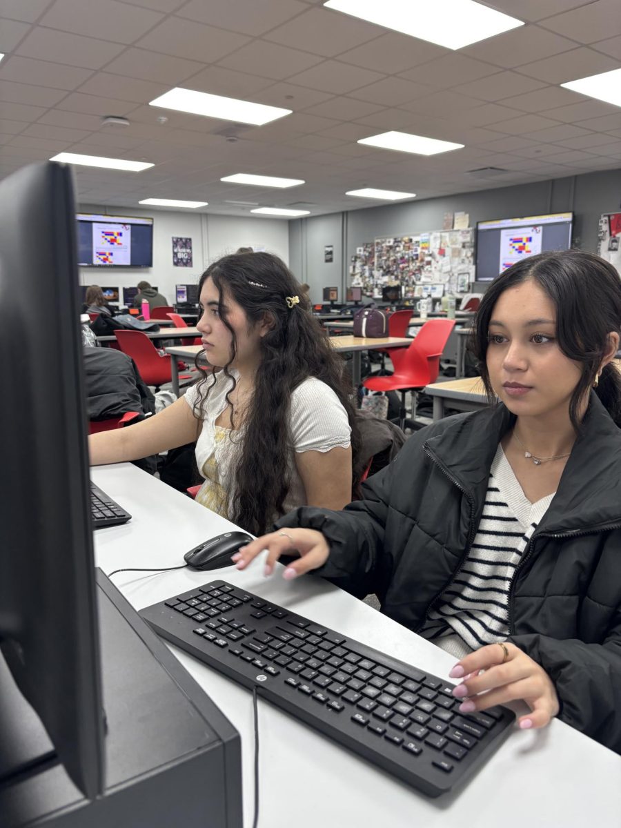 In web design class, juniors Madison Smith and Zeny Stroud, practice coding tables. They have been learning about tables, and now are coding them on websites. “Coding tables is very important because it can help make a website look more professional”, Smith said. “This is one of the more difficult concepts we have done in class, but practicing makes it a lot easier.”