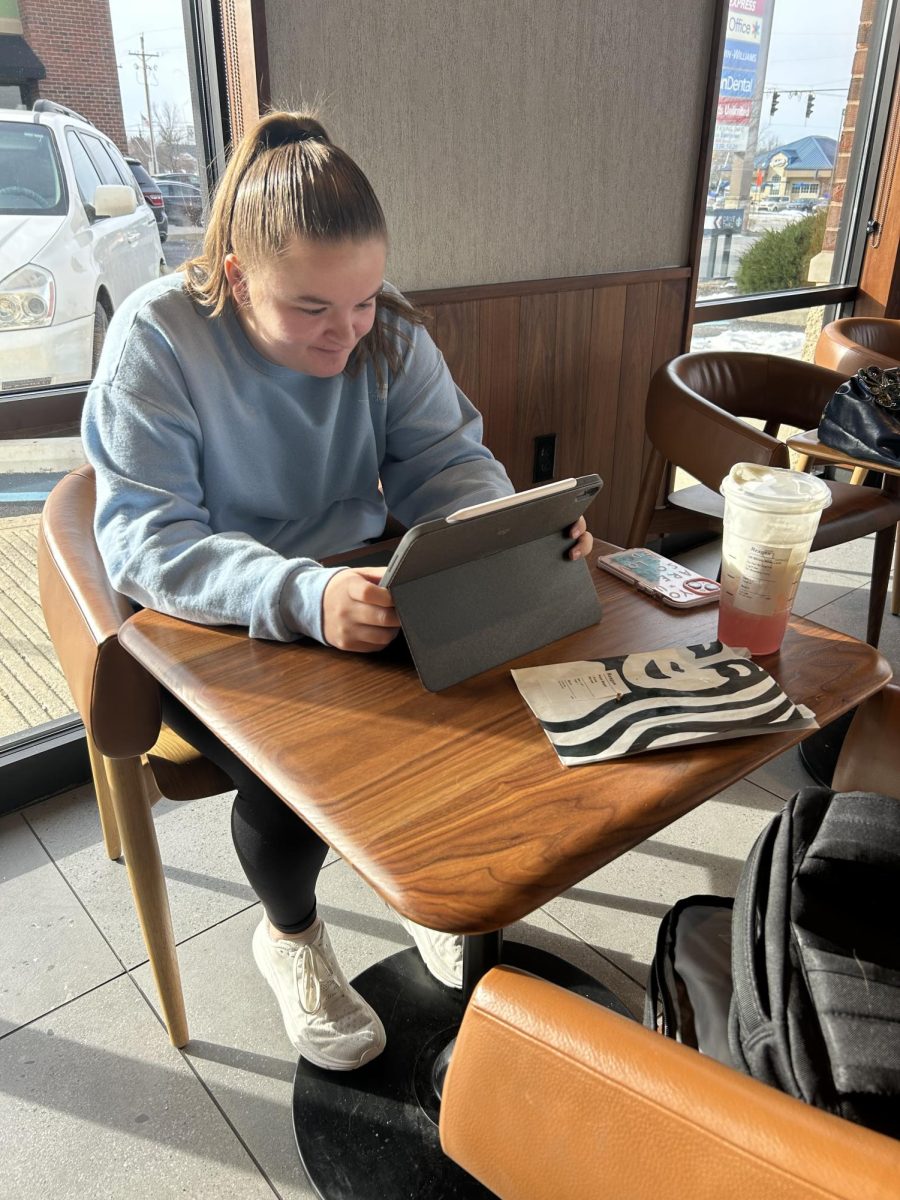 Senior Reagan Snyder takes advantage of her seat waiver and does her schoolwork at Starbucks. “I enjoy using my seat waiver to get ahead in some of my classes to lessen my workload during busier weeks,” Snyder said. 