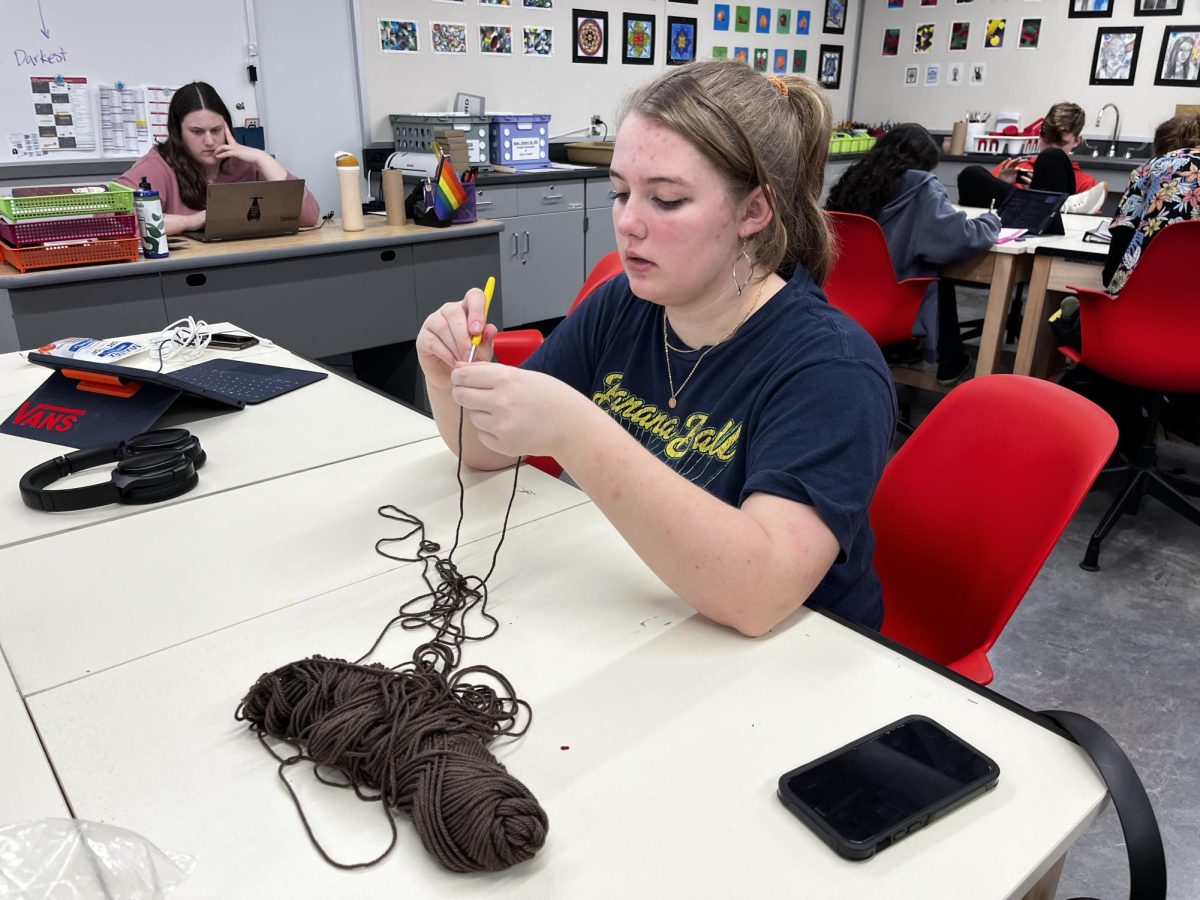 While at the crochet club meeting, senior Vanessa Tidrow weaves together a gift for a friend. Crochet club meets every Tuesday during AIM. “I love crocheting because it gives me a chance to express myself and also being able to help others express themselves too,” Tidrow said.