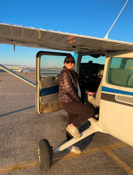 Sophomore McKenna Thacker boards a plane before a test flight.