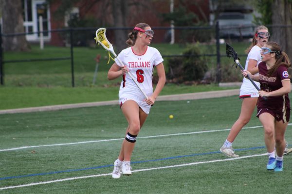 Senior Emilee Franklin cradles the ball during the Trojans' win against Brebeuf.