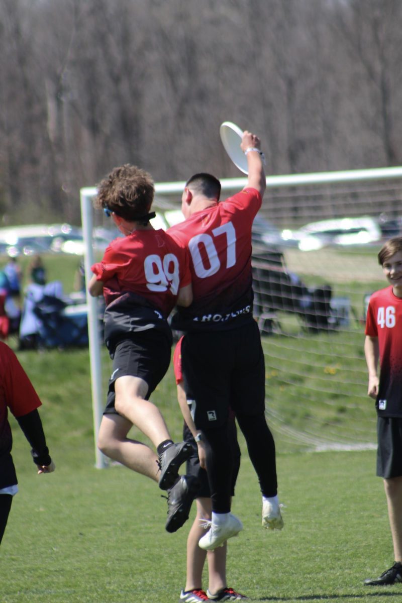 Sophomores Jeremiah Brown and Merrick Brown celebrate with a shoulder bump during an ultimate frisbee game. This came after a connection between the two down the field into the end zone for a point. “Our connection has been special this year,” Brown said. “Since we’re close friends, we feel like we know each other really well, and are able to connect and combine on the field.”