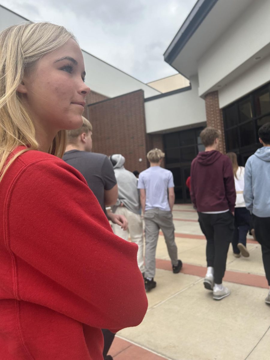 Freshman Alivia Hennessey waits outside during the monthly fire drill. It was specifically held on that day to test the fire safety equipment in the new academic pavilion that is currently under construction. “I enjoyed the fire drill because it gave me a break from class to go outside and it gives me peace of mind knowing that in case there is a fire we will all know what to do," Hennessey said.