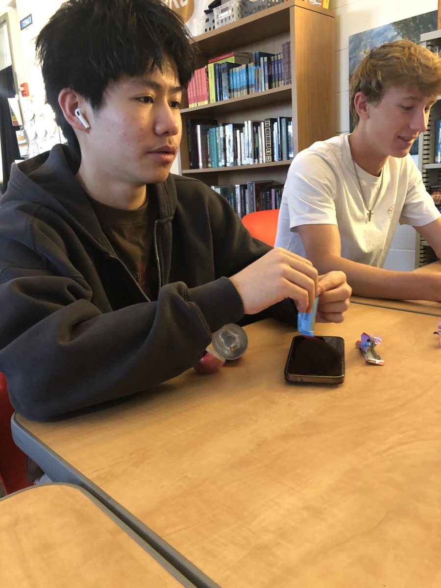 Senior Albert Liu eats a chocolate from an easter egg. In honor of the holiday, AP Literature teacher Josh Surface hid eggs throughout his class, while students attempted to find the treats inside. ""My favorite part about the easter egg is the chocolate. Mr. Surface is a really cool teacher for doing a mini easter egg hunt in the class."