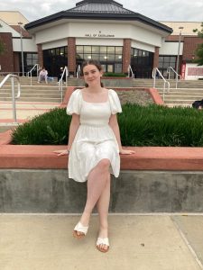 Junior Audrey Johnston wears a white dress following Le Diner Blanc, a French tradition where participants wear white in a white-themed atmosphere.