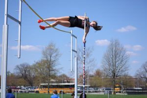Senior Khloie Walker soars over the crossbar during a meet at Columbus North on April 12, 2025. She finished first in the meet with a final height of 11' 6".