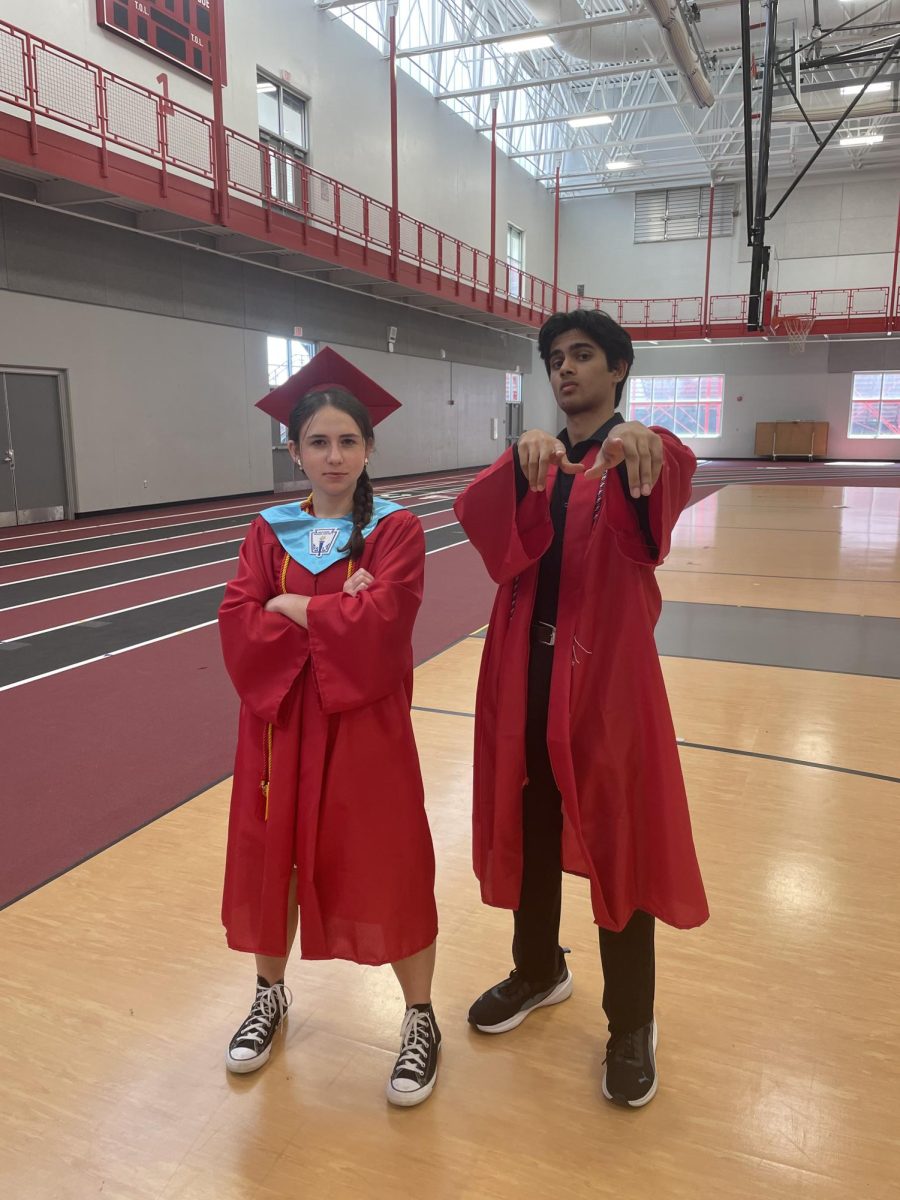 Seniors Julia Lucas and Gourav Pany pose for a picture following graduation ceremony practice. Both believed their poses were cool; they were wrong.
