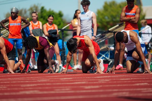 Senior Daxon Sauer takes the line in the 100 meter dash at the Columbus North invite. Sauer placed first in the race.