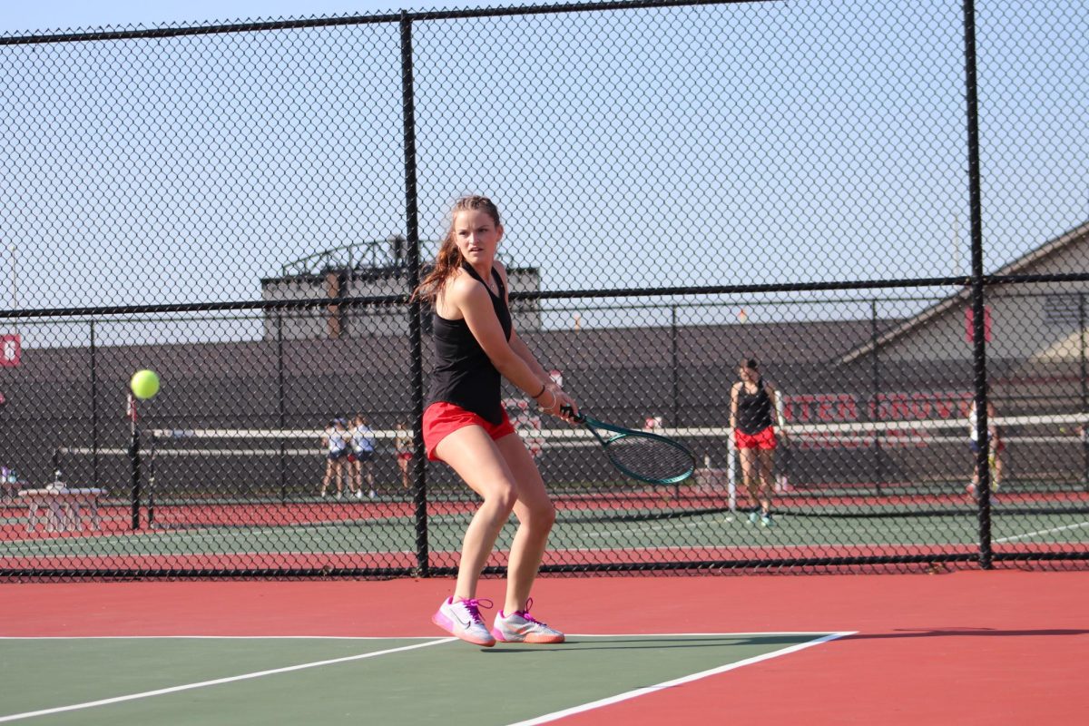 Senior Ashley Embrey sets up to return a serve against Perry Meridian.