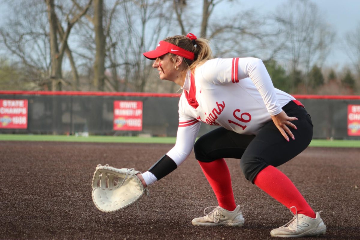 Senior Sydney Herrmann fields the ball from first base during the Trojans' 6-1 win against Fishers.