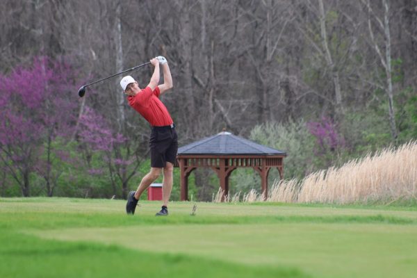 Senior Noah Parsetich tees off in the Trojan Classic, which Center Grove won while competing against four other teams.