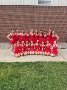 The dance team poses with the trophies they earned over the duration of their stay at the summer camp.