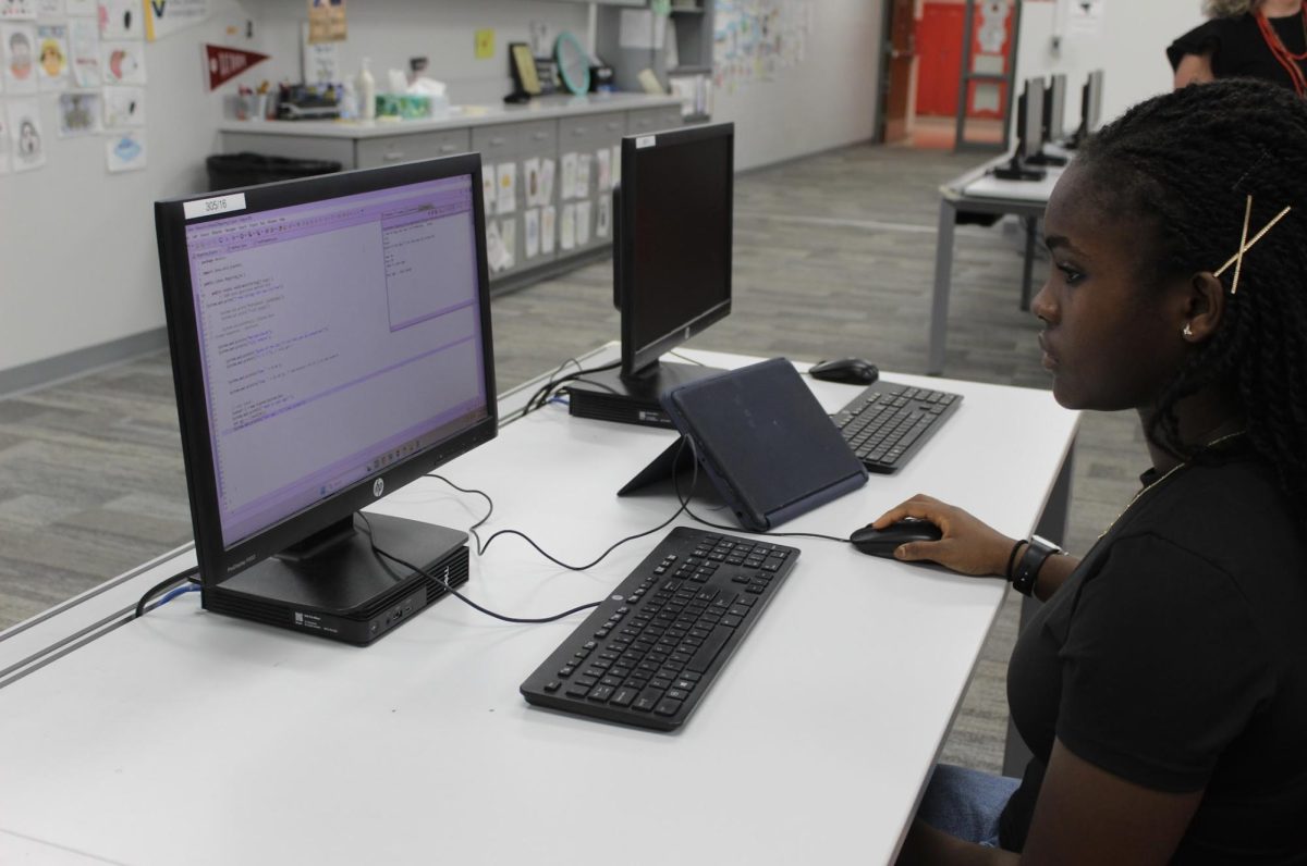 During Mrs. Ehresman's Computer Science class,  Senior Marilyn Jallah works on coding using a coding application called Java. The coding application used numbers and texts to programs system of steps. "I like the coding and creating your own programs," Jallah said. "It helps me with other classes like math to understand data and configuration."