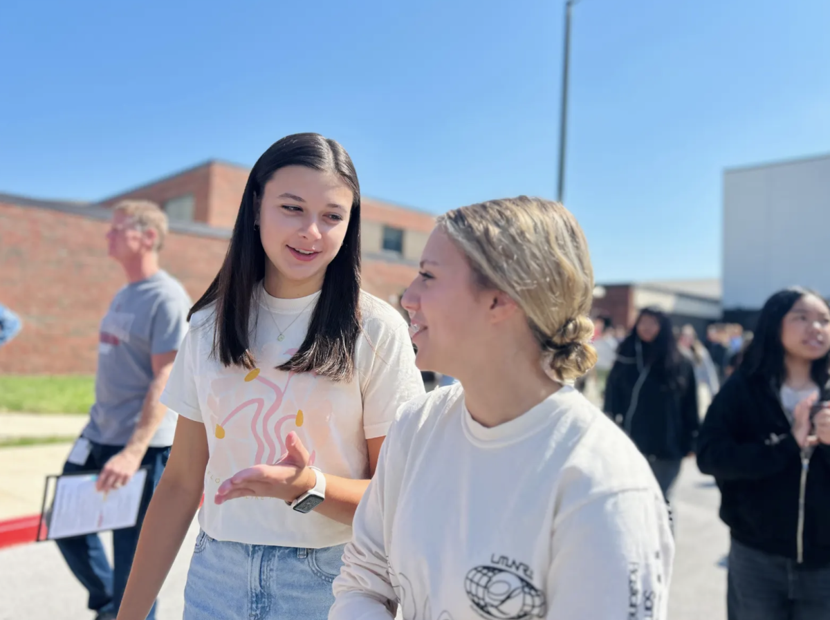 Ally Hopkins (‘26) chats with Ashley Line (‘26) as they exit the school building during a routine fire drill. The fire drill occurred during STaR on Friday, just one week after CGHS conducted a prior fire drill. The July and fire drill was conducted in order to be in compliance with state law. “I don’t like how frequently we have to do fire drills, but I’m glad we have measures in place to keep students safe in case of an emergency,” Hopkins said. 