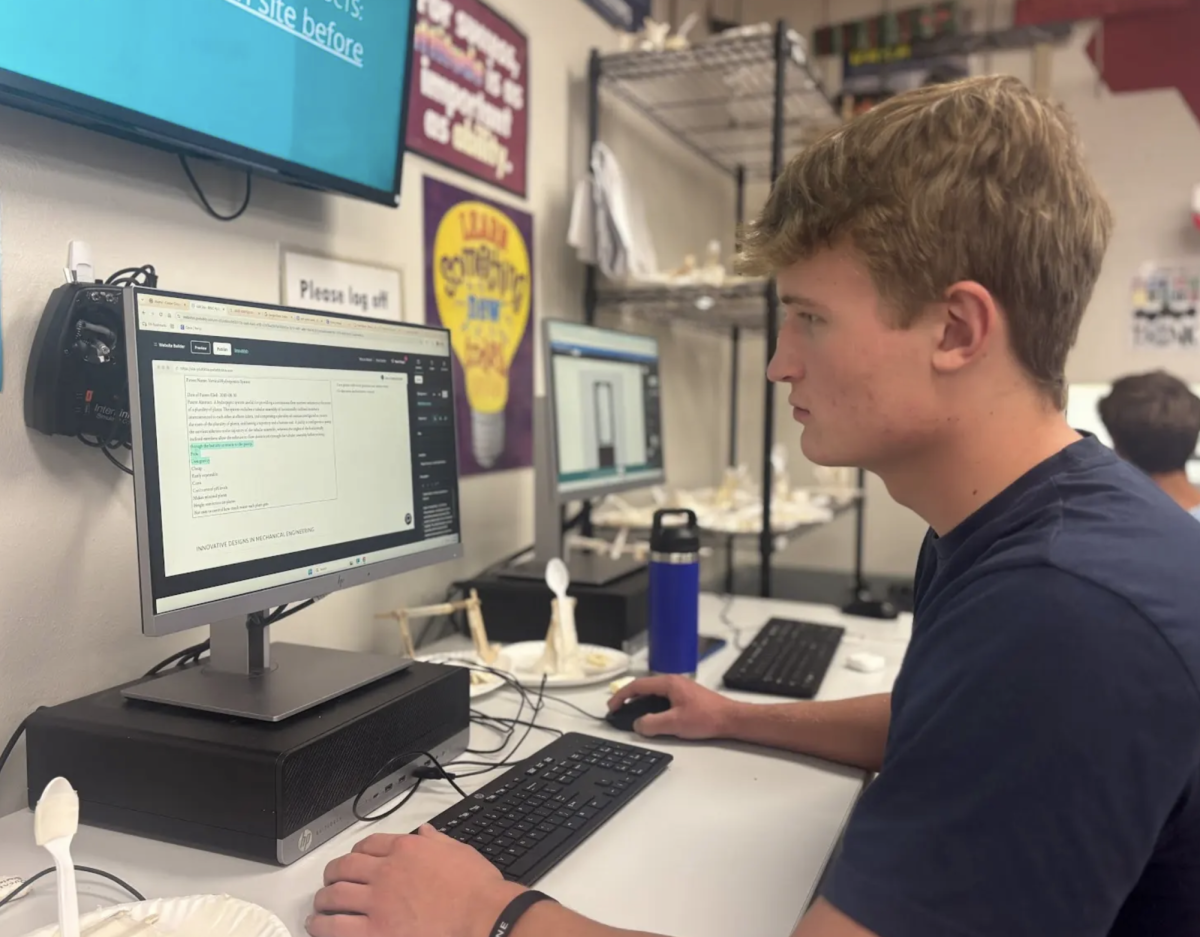 Typing on the keyboard, Senior Blake Downen builds a website for Engineering Design/Development. In this class students were makings a website to showcase a new product that helped find the pH and water levels of a Vertical Hydroponic Farming System. “We really started from ground zero and had to figure out a solution to a problem. I feel like this is difficult because we are so used to just immediately going to figure out the solution instead of taking our time with the steps,” Downen said. “My favorite part about it is being able to get real world feedback from actual engineers.”