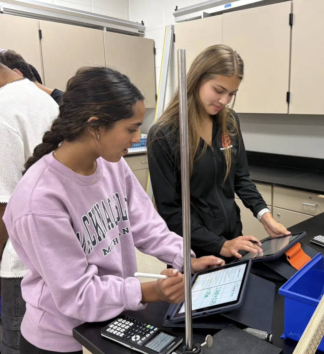 In Mrs. Elsner’s 9th period physics class, junior Ava Faulkner works with her lab group to launch ping pong balls to gain a visual understanding of horizontal motion. “We’re calculating how much time and how far a good ball needs to roll to land on a certain point on the floor to help us learn about horizontally launched projectile motion,” Faulkner said. “I like doing labs because it gives me a hands-on learning experience to learn a new physics skill.”