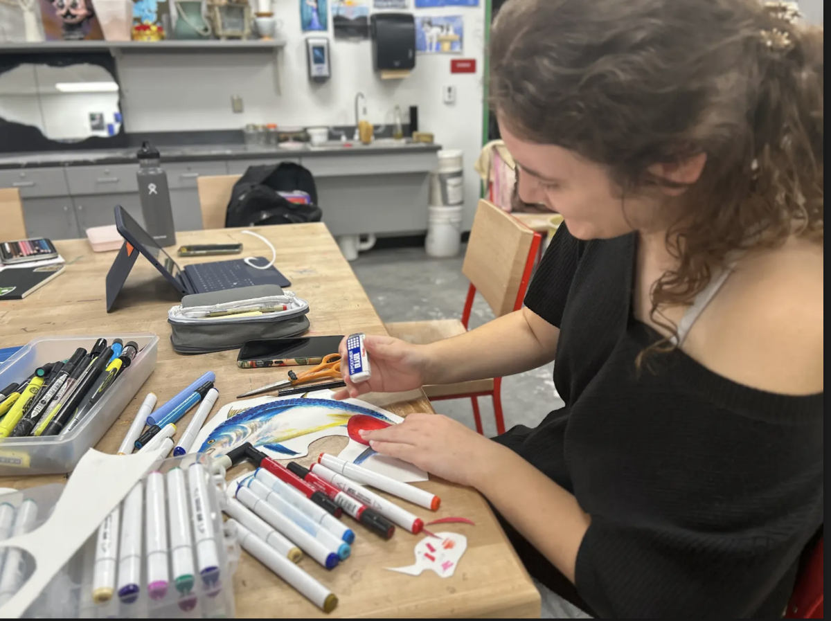 In Nathan Fry's AP 2D Studio Art class, senior Jessie Anness uses an eraser to blend the colors on her artwork. Unlike other AP classes, studio art does not have an AP test at the end of the year; instead, they have a portfolio, which they begin cultivating from the first day of school, and submit their completed portfolio for college credit at the end of the school year. "I enjoy having a portfolio because I don't have to stress at the end of the school year studying for a test," Anness said. "Being able to work with my teacher and getting opinions from classmates throughout the process of my portfolio is super helpful. It helps me to ensure that my work is high quality, and gives me a better chance to get a high score from College Board."