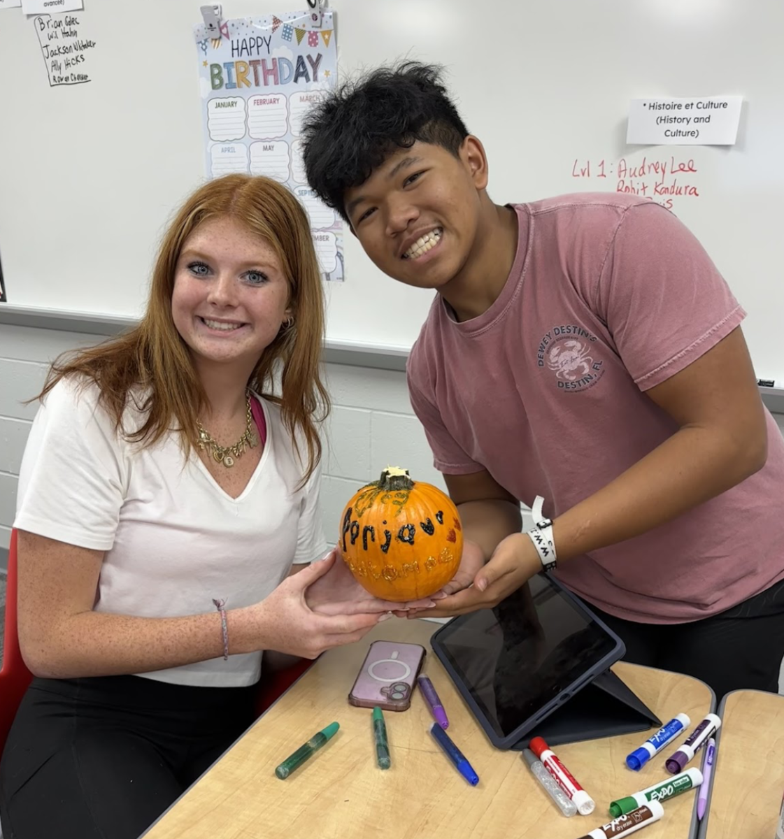 Sophomores Rainan Nguyen and Elyse Beuoy paint pumpkins in teacher Ashlee Vitz's French 3 class. Nguyen said it was fun to decorate the pumpkins. Beuoy agreed, “It’s fun to decorate and get creative with it.”