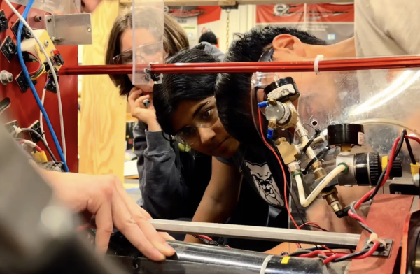 "Sophomore Netri Krishnan works on rewiring a robot used by Red Alert, the Robotics team, as a member of their Engineering subteam. Students on the team practice a variety of skills, such as programming, design, machining, electrical engineering and graphic design.  “We’re wiring the radio wire into our robot from 2014 so we can drive it around at outreach events, showing people what we can do,” Netri said.