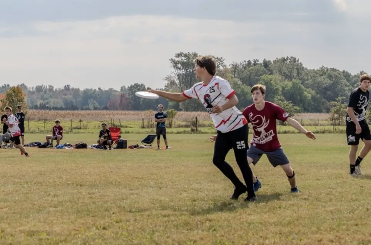 During the Boiler Breakaway, an Ultimate Frisbee tournament that features colleges and universities from the midwest, senior Aaron Feitl passes a disc to his teammate. Center Grove was the only high school team invited to the tournament and went 4-1 on the weekend, with wins against Valparaiso University, Michigan State University, Rose Hulman University and Purdue University. "It's really challenging playing against college teams," Feitl said. "They run different formations than most high school teams which helps us practice adaptability during the game."