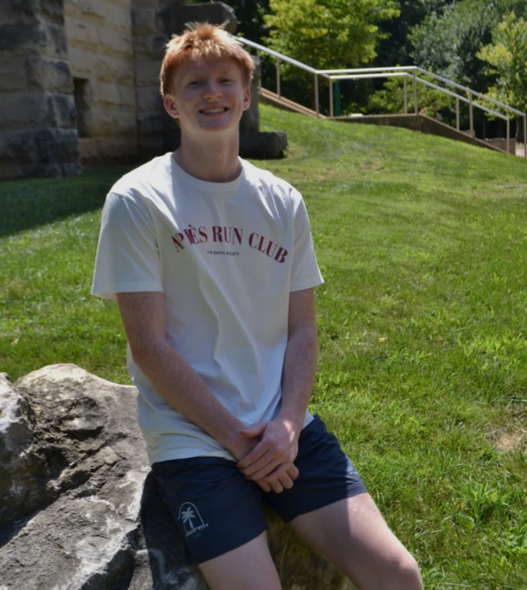 Senior Cole Messer models a piece from his clothing brand Swith
