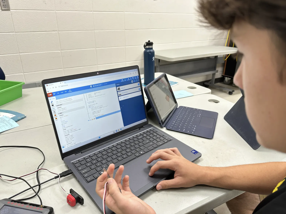 Working on his Principles of Engineering project, sophomore Keanen Teevan programs a Vex Brain. This was part of a larger multi-day project teaching students how to program using Python. “I have really enjoyed getting to learn a programming language," Teevan said. "It’s a useful skill that can help me get jobs later in life. It is also a lot more fun than taking notes and then taking a test. It has been a bit challenging, but once I figured it out, it felt really rewarding.”
