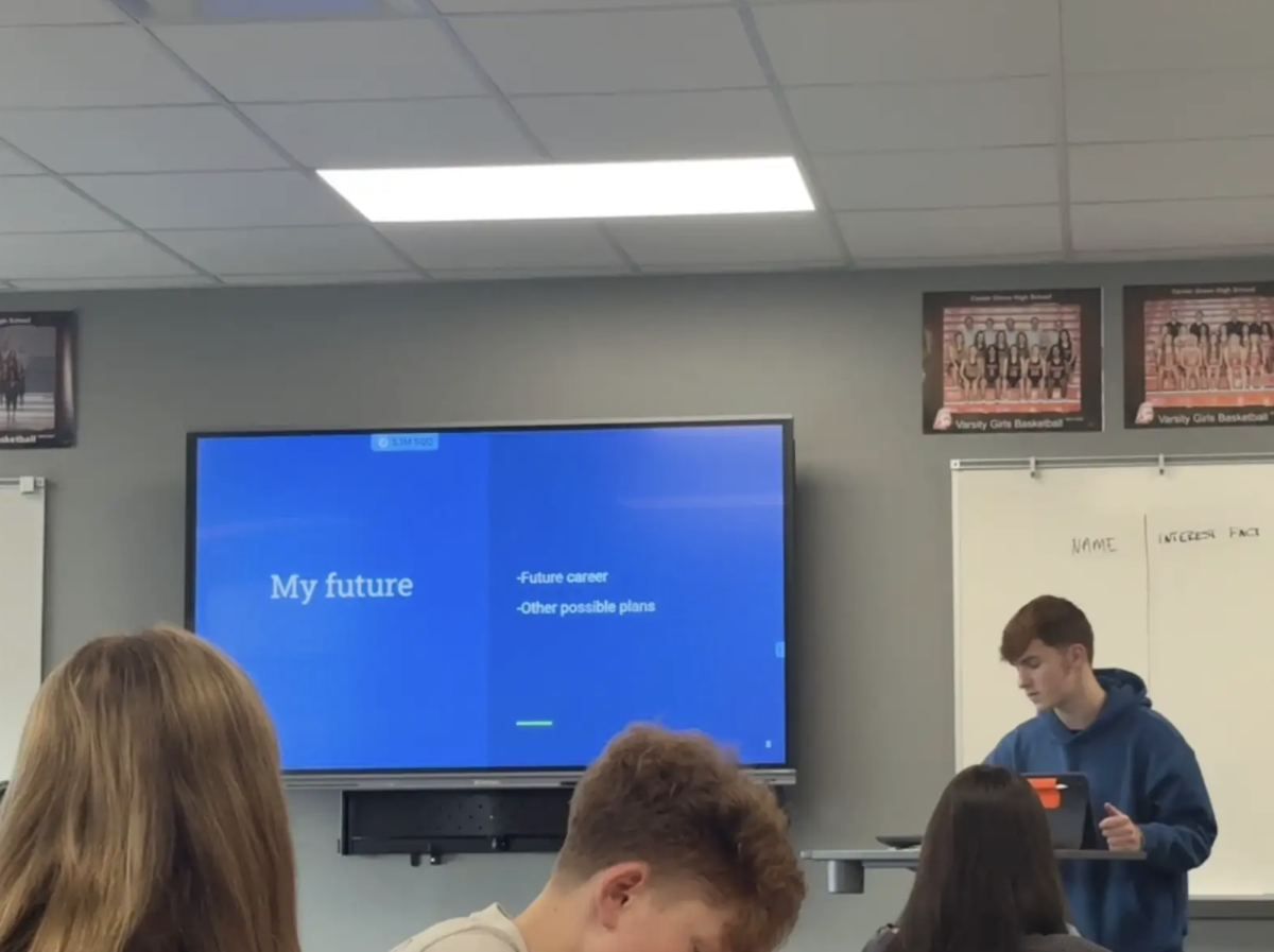 Presenting in Intro to Business class, Gage Dobbins 27’ speaks about his future goals. Students have prepared presentations after a google slide unit to transform their presenting skills. “It’s helping me be more comfortable presenting,” said Dobbins “It has helped with me preforming in front of large groups as well.”