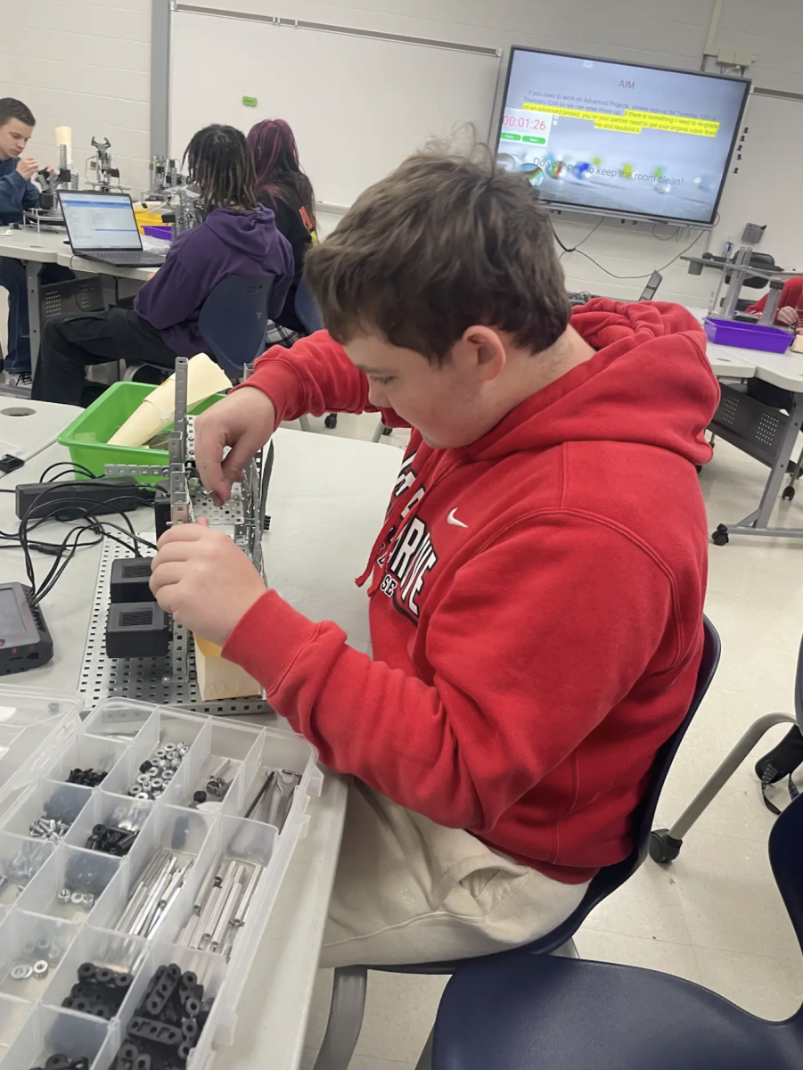 Working on a project for Teacher Anne Elsner’s Principals of Engineering class, Freshman Jackson Stiles works on a trapdoor for a marble sorter. “I like this project because it is a lot of building and problem solving,” Stiles said. “It is very challenging, but it is fun at the same time.”