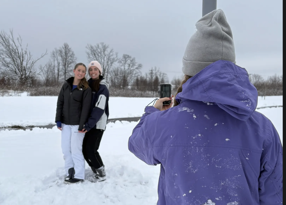 During Tuesday's snow day, senior Andra Veleta takes a photo of junior Gretchen Meisberger and senior Adri Rosales. Rosales and friends went to Freedom Springs to sled and take pictures. “Me and some friends went to Freedom Springs to sled and take pictures,” Rosales sales. “It was a good break from school and gave us something fun to do other than our homework.”