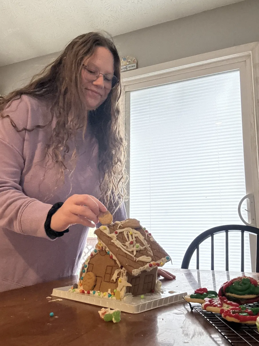 After taking her finals, sophomore Hailey Cambron constructs a ginger bread house. Hailey wanted to take the time after finals to be able to relax and decompress with something fun. "I really enjoyed being able to leave early this week," Carmbron said. "I do better on my finals when I have down time to study and do fun activities."
