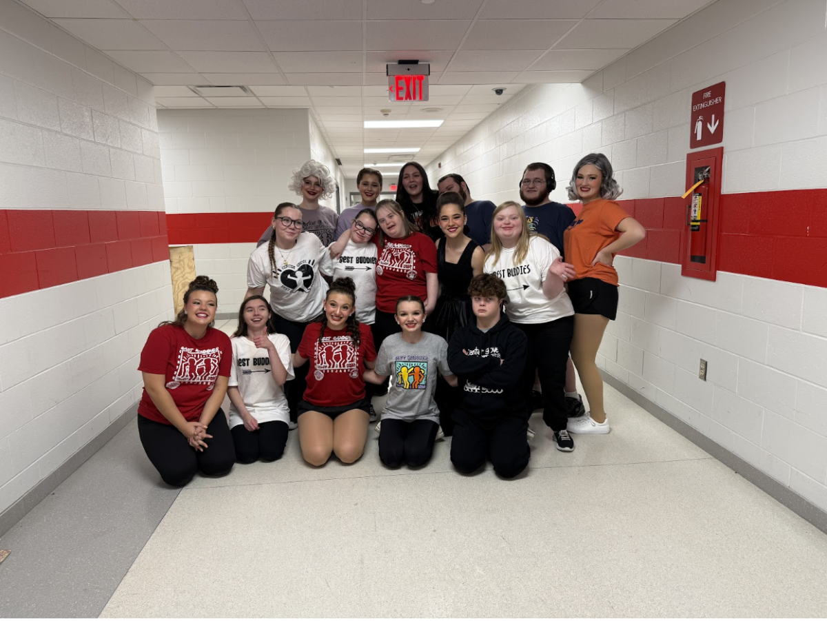 Members of the Best Buddies act pose for a photo backstage on Tuesday before the show
