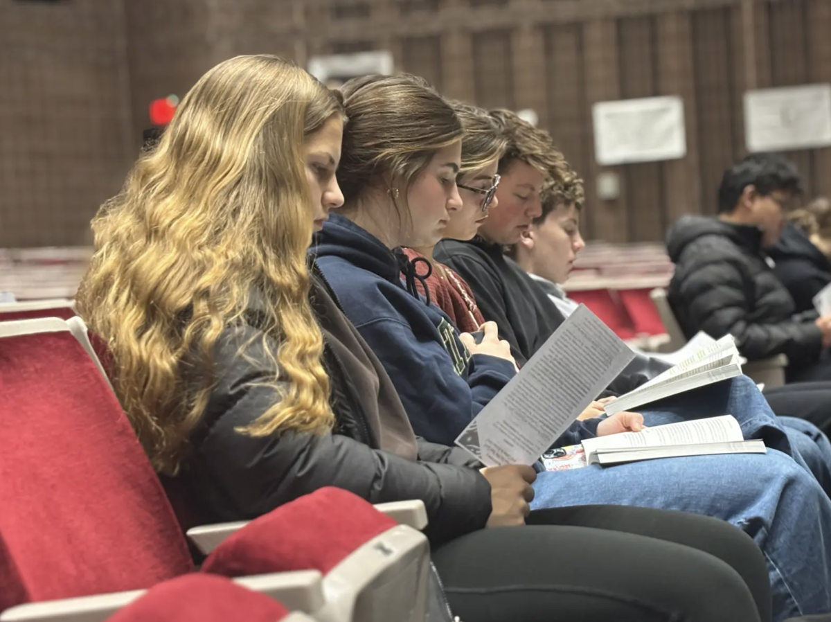 Lilah Weddle '27, Lauren Towne '27 and other FCA members follow along with FCA's new series of lessons. To start off the semester, FCA started a new series with their lessons by using the book, "The Gospel Catechism," which is a uses a common societal question followed by an answer based around the Bible. "I really enjoy the book," Towne said. "I bought a copy for myself. It's full of questions that give us deeper understanding of the passages we read, and it gives us references that we can use in the future. I like having it as a resource for years to come and not just at FCA."