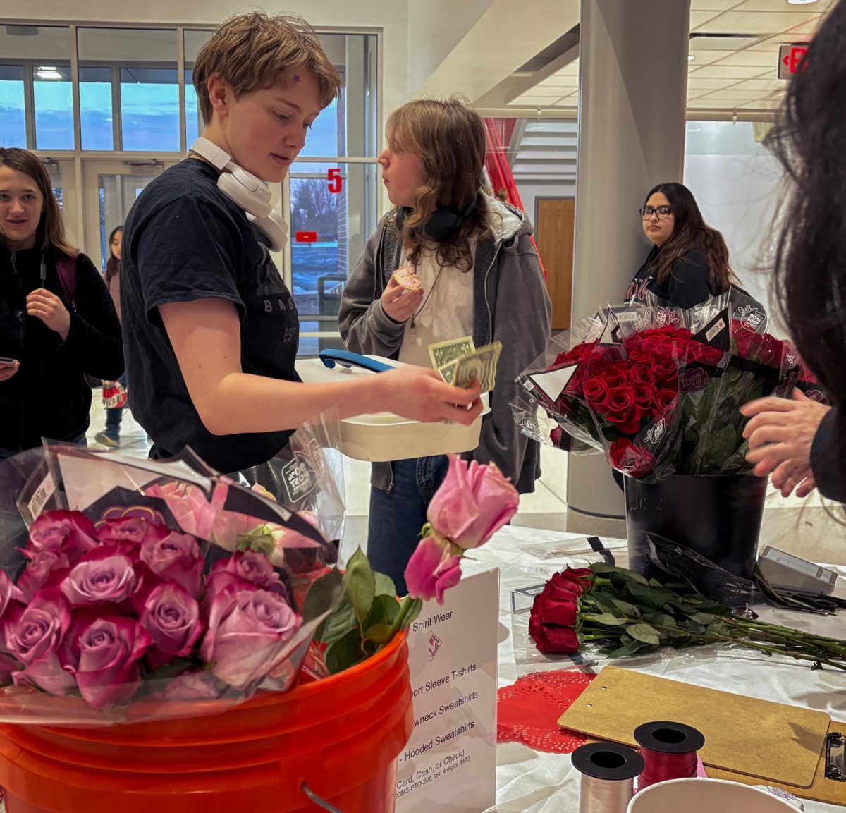 In honor of Valentine's Day, junior Abigale Lyle purchases a flower. The PTO provided students a way to get a simple gift for friends, teachers and valentines. “I like this because I am not able to buy flowers at home,” Lyle said. “It’s a good way to help students who aren’t always able to get them.” 
