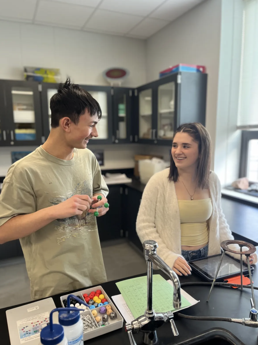 In teacher Timothy Eddy's 7th period Chemistry I Honors class, sophomore Victor Zimmer and freshman McKenna Peterkin build 3D Lewis structures of different molecules during a lab.  The activity helped students visualize how molecules were structured beyond what can be seen on paper. It allowed them to apply their knowledge of bonding and electron placement in a hands-on way. "Creating the models helped me visualize molecular geometry and understand how the electron arrangement affects the structure," Zimmer said. "It made the concept clearer than just drawing it out."