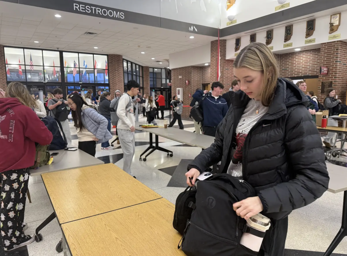 Walking through metal detectors upon arrival at school, Tessa Dice '28 puts her stuff back into her backpack after being searched by administrators and police officers. After threats circulated on social media overnight and one arrest was made in Indianapolis, administrators and CGPD prioritized student safety. “It was crazy and unlike anything I’ve ever seen," Dice said. "I felt like I was at the airport with all of the metal detectors and police.”
