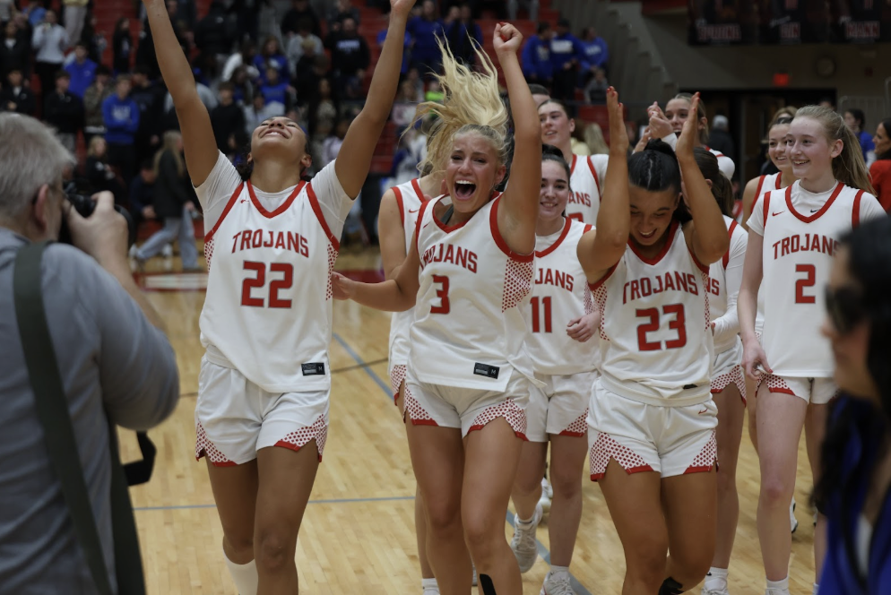 The girls basketball team celebrates winning the Sectional Championship against Franklin Central last weekened.
