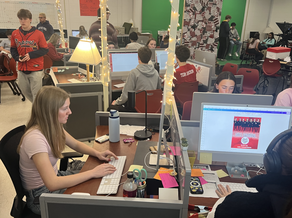 Publication students work in the lab during fifth period on Friday. Students in publications produce the Trojaneer website, the Trojan yearbook, the weekly CGTV broadcast and run three social media accounts.