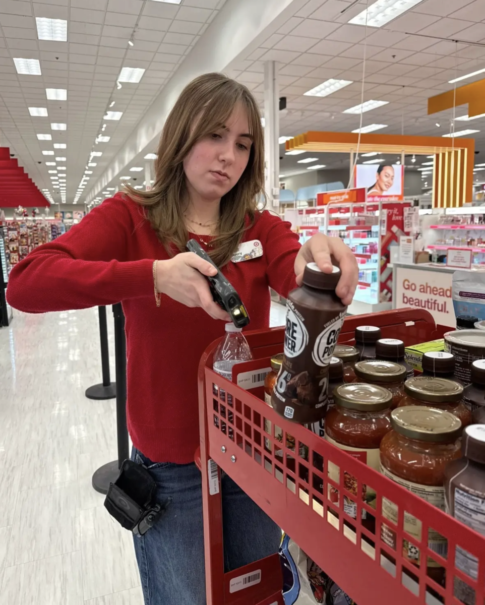 Senior Avery Cutchens collects items for an online order at Target. Cutchens has worked at Target for over a year and a half and has experienced many positions. “My favorite department is fulfillment because I like staying active and having something to do,” Cutchens said, “I enjoy picking and packing orders because it feels fast-paced and organized most of the time”. 