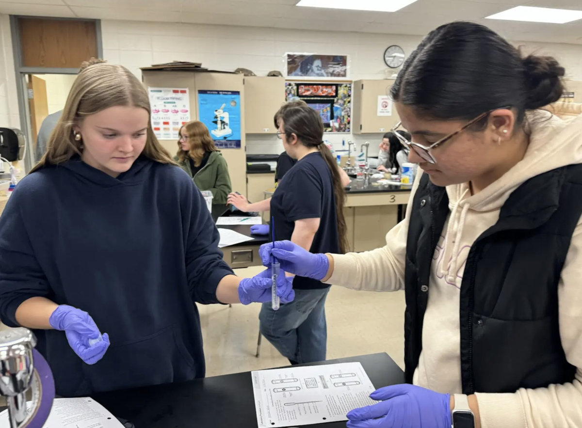 Mia Marlin ‘27 and Armaanpreet Kaur ‘28 work together to transfer bacteria into a plasmid in Mrs. Meyer’s period 10 AP Biology class. The class did a bacteria transformation lab to go along with their gene expression and regulation unit. “By participating in the lab, I learned how genetic material can be introduced into bacteria to change their traits, which helps me understand the basics of genetic engineering,” Marlin said. “This knowledge will be useful in class for understanding topics like DNA, gene expression and biotechnology applications.”