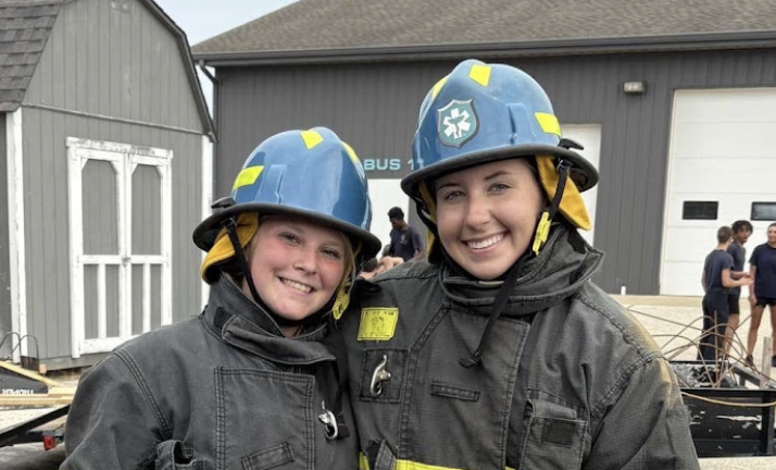 Standing in front of their training base, Layla Dyson ‘27 and Maddie Green ‘26 gear up for firefighting preparation