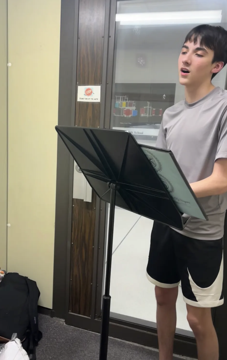 Preparing for the upcoming competitive choir auditions, sophomore Mason Smith practices his song. JV members must prepare a song of their choice and a 45-second dance they learned in class. “With upcoming auditions, it’s really important to get advice from other people to do your very best,” Smith said. “My friends and I were practicing our songs to give each other constructive criticism and make improvements before next week.”