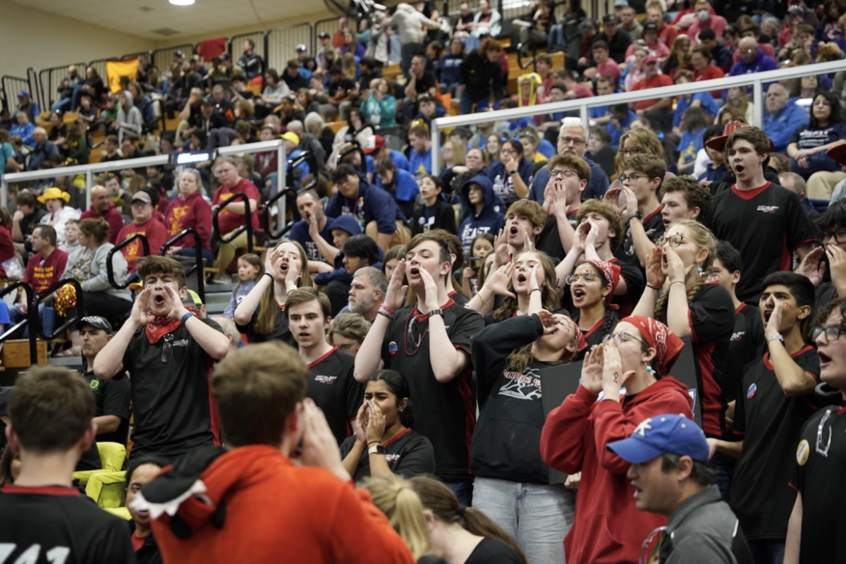 Members of Red Alert Robotics cheer at one of their most recent competitions.